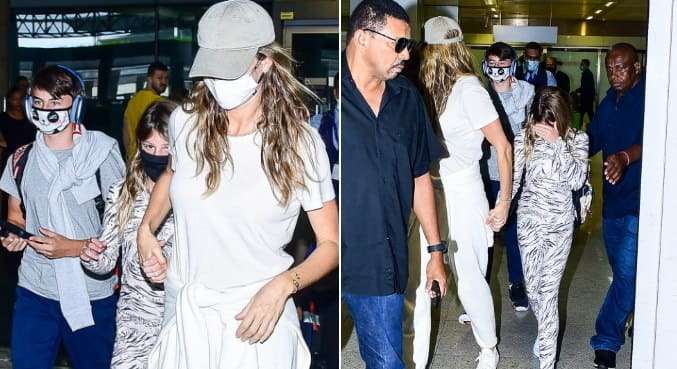 Após divórcio, Gisele Bündchen tenta desviar de fotógrafos ao desembarcar no Brasil com os filhos