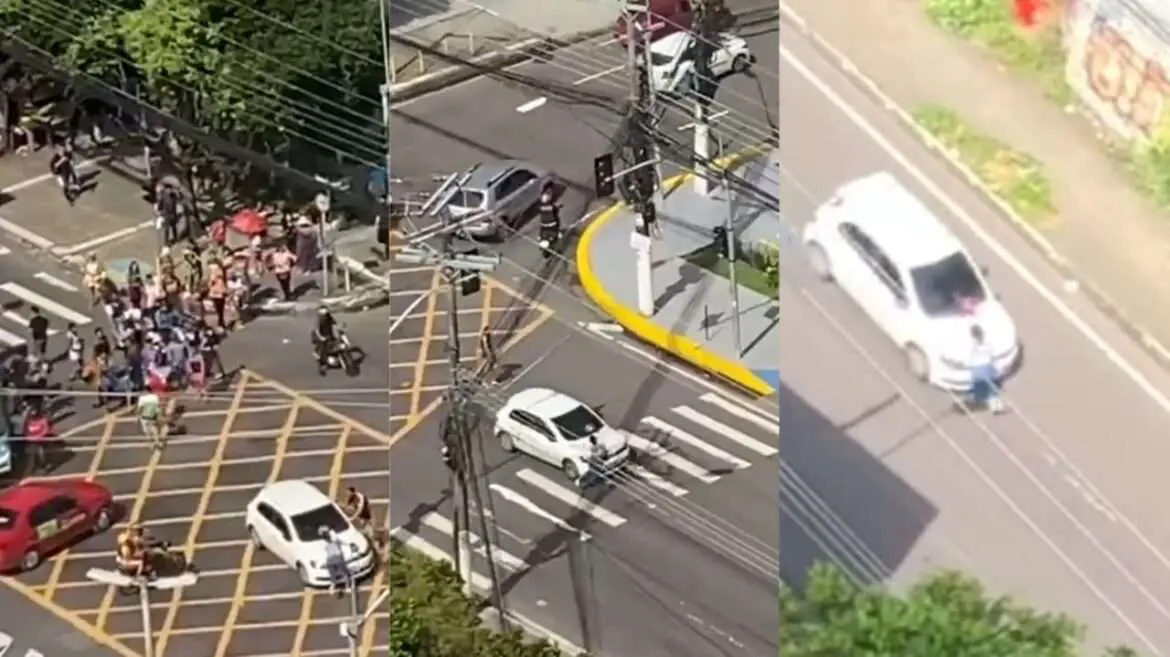 Motorista fura protesto e mulher de pendura no carro em movimento para não morrer ( veja vídeo )