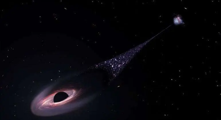 Nasa vê pela primeira vez buraco negro com rastro de estrelas cruzando o espaço